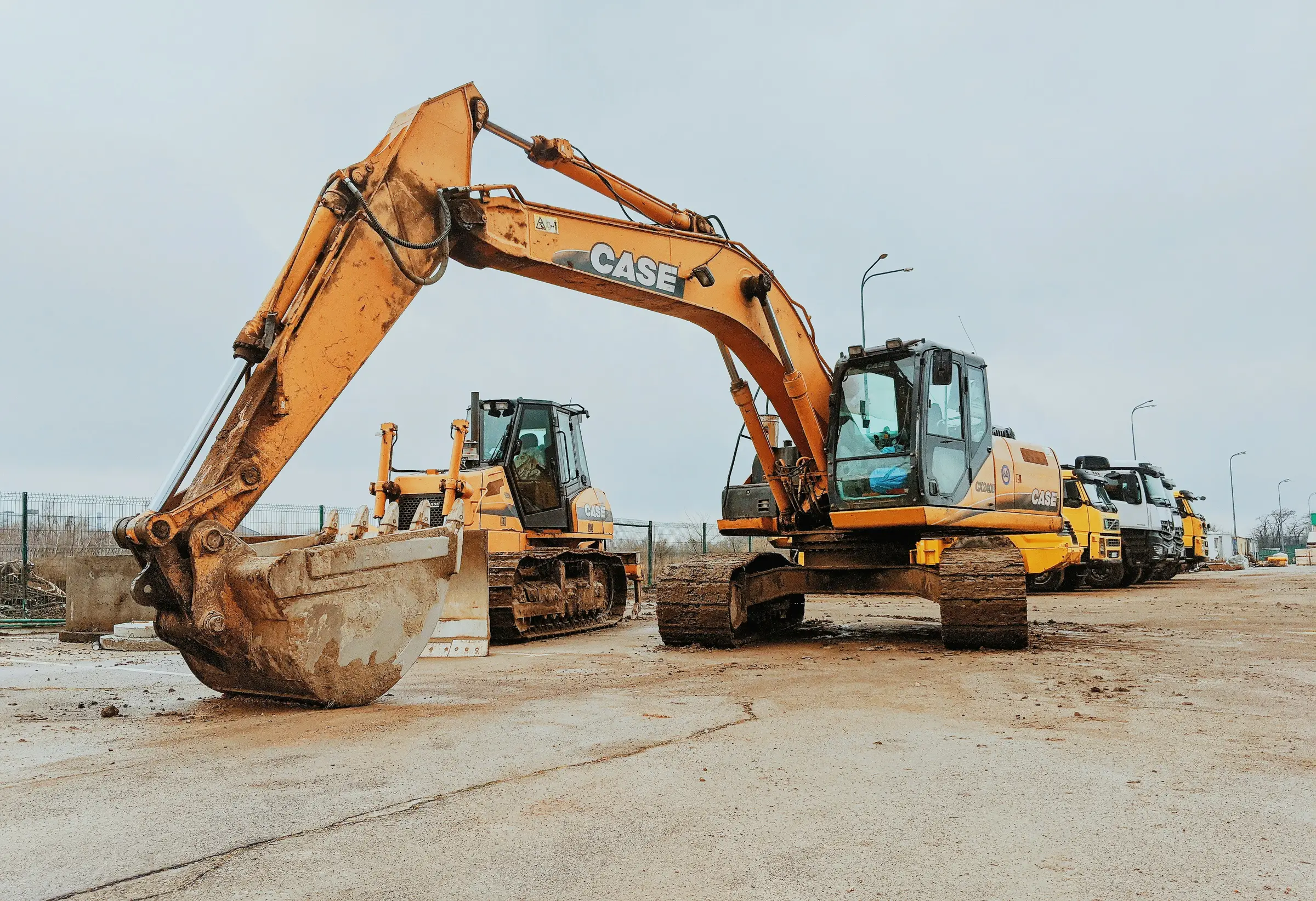 Row of excavators and construction machines in a machine yard