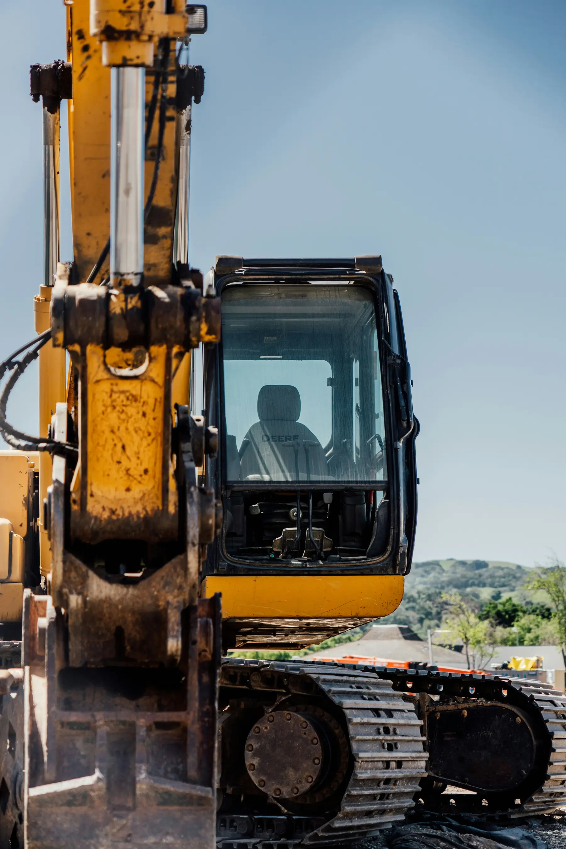 Close-up of the cab of a yellow excavator